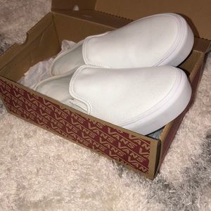 White platform slip on vans